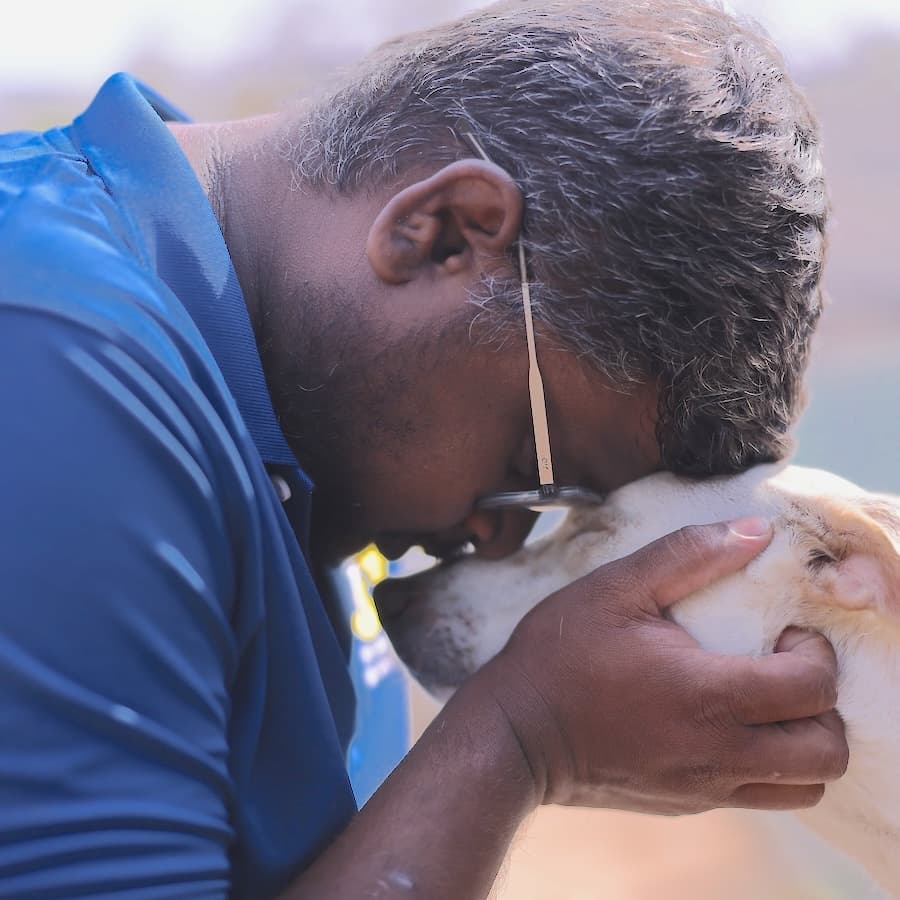 A PAWS Chennai staff member with a rescued dog